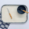 Blue rimmed platter and blue dip bowl