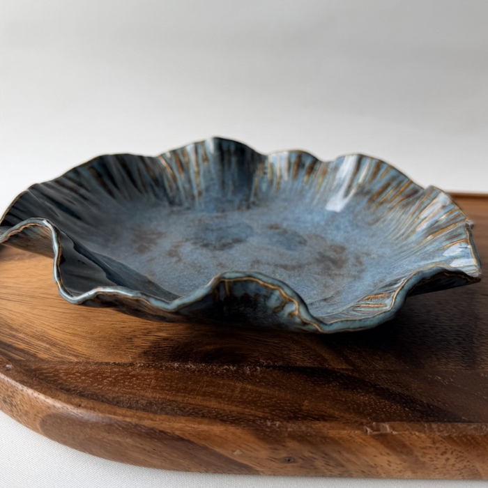 Textured curved rim bowl with denim glaze